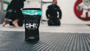 Pre-workout supplement packet in a gym setting.